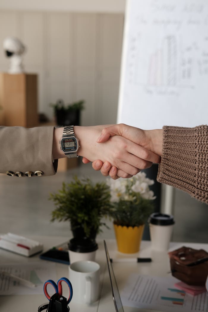 Shaking Hands over Table